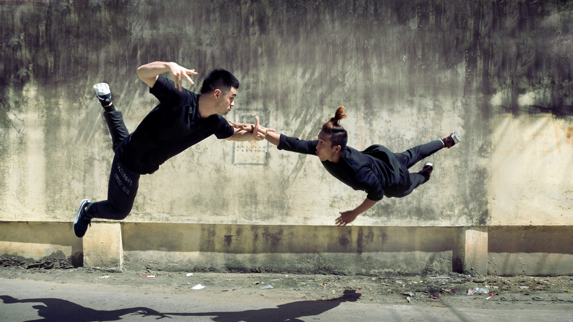 Two dancers mid air