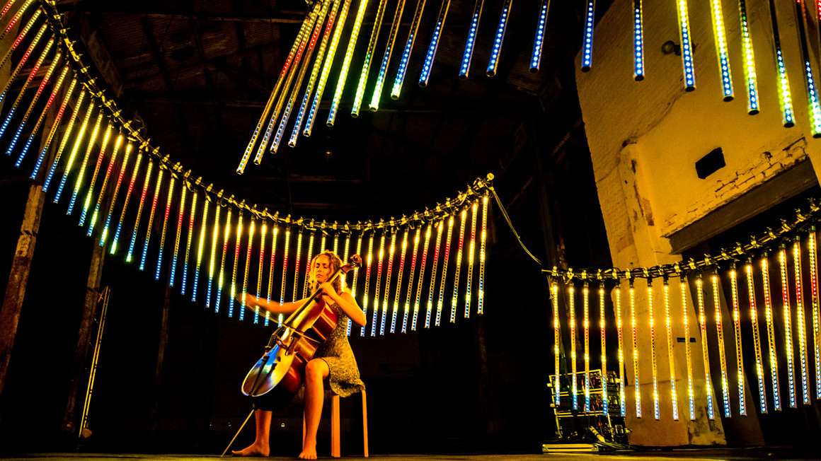 Cello player in light spiral