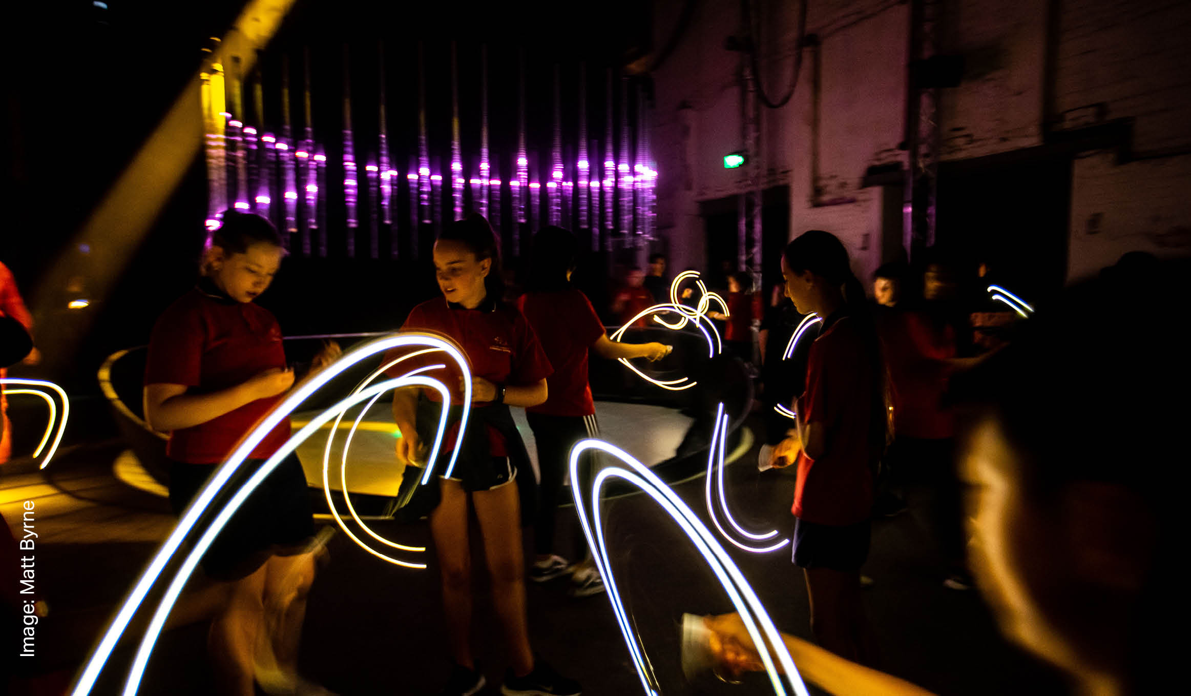 Kids among swirling light